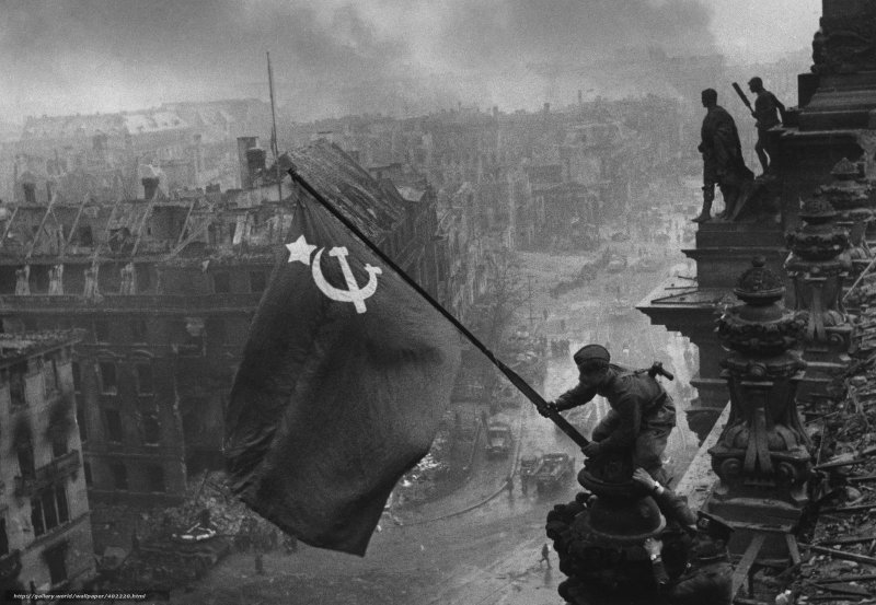 Raising a Flag over the Reichstag, by Yevgeny Khaldei